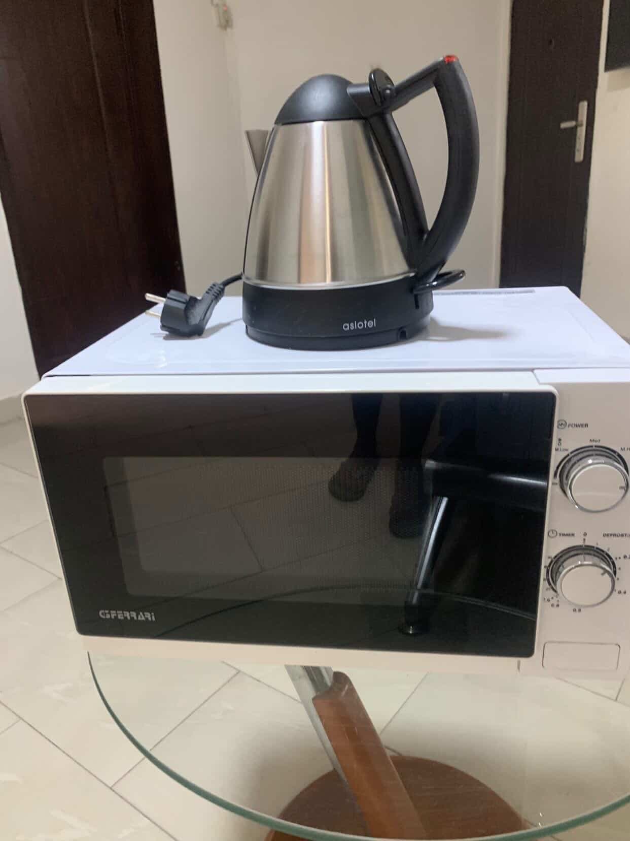 Neatly Used Microwave and 1 Liter Kettle