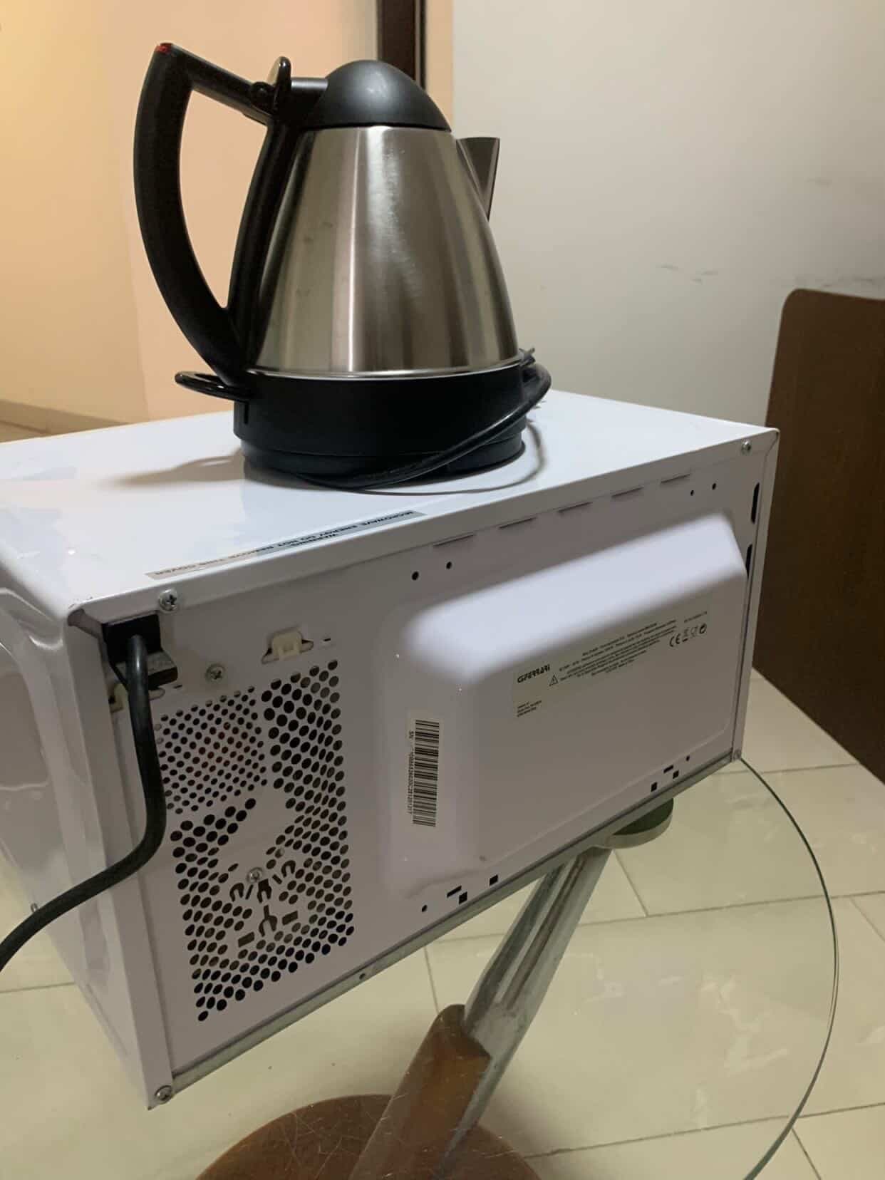 Neatly Used Microwave and 1 Liter Kettle