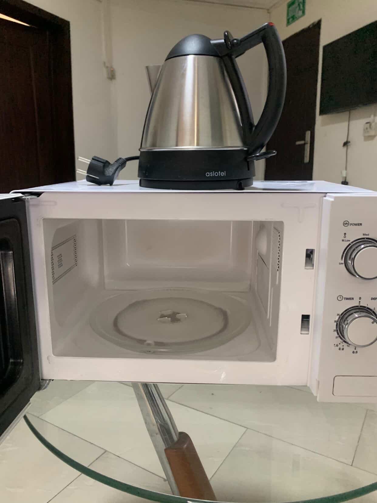 Neatly Used Microwave and 1 Liter Kettle