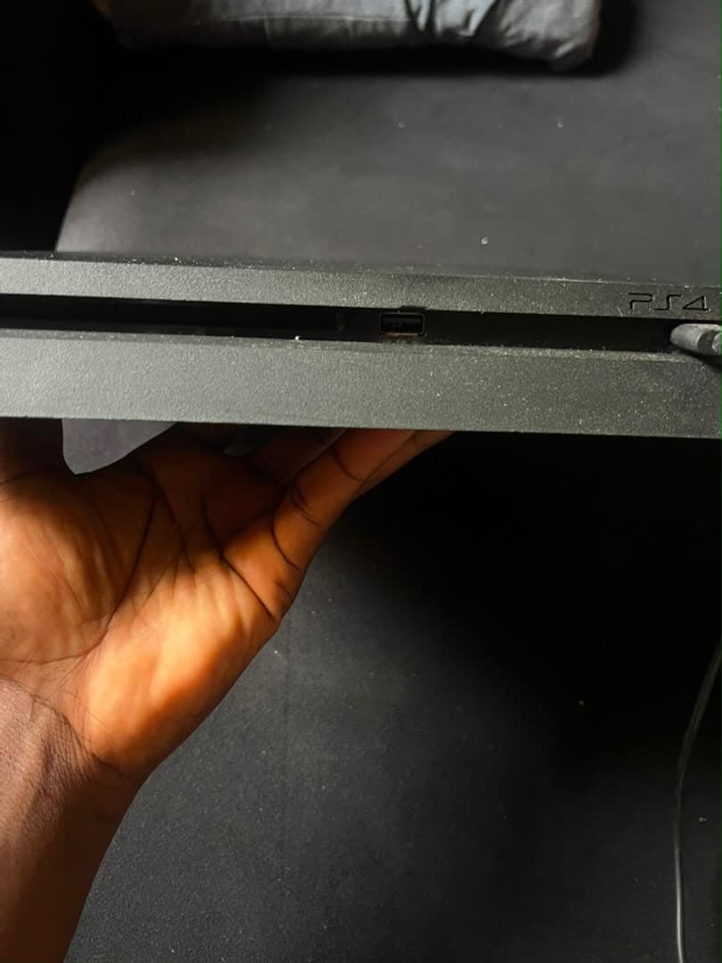 Neatly Used PS4 Slim with 2 Pads and 9 Games
