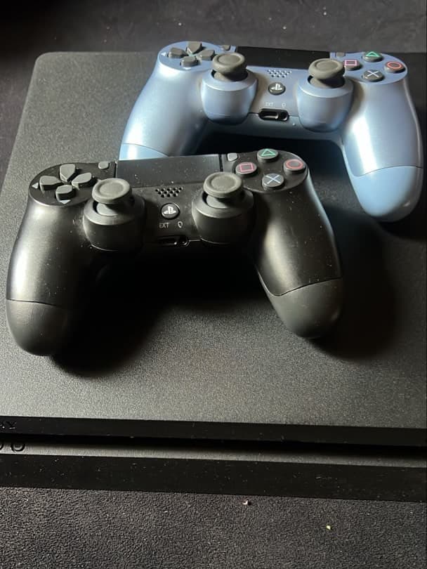 Neatly Used PS4 Slim with 2 Pads and 9 Games